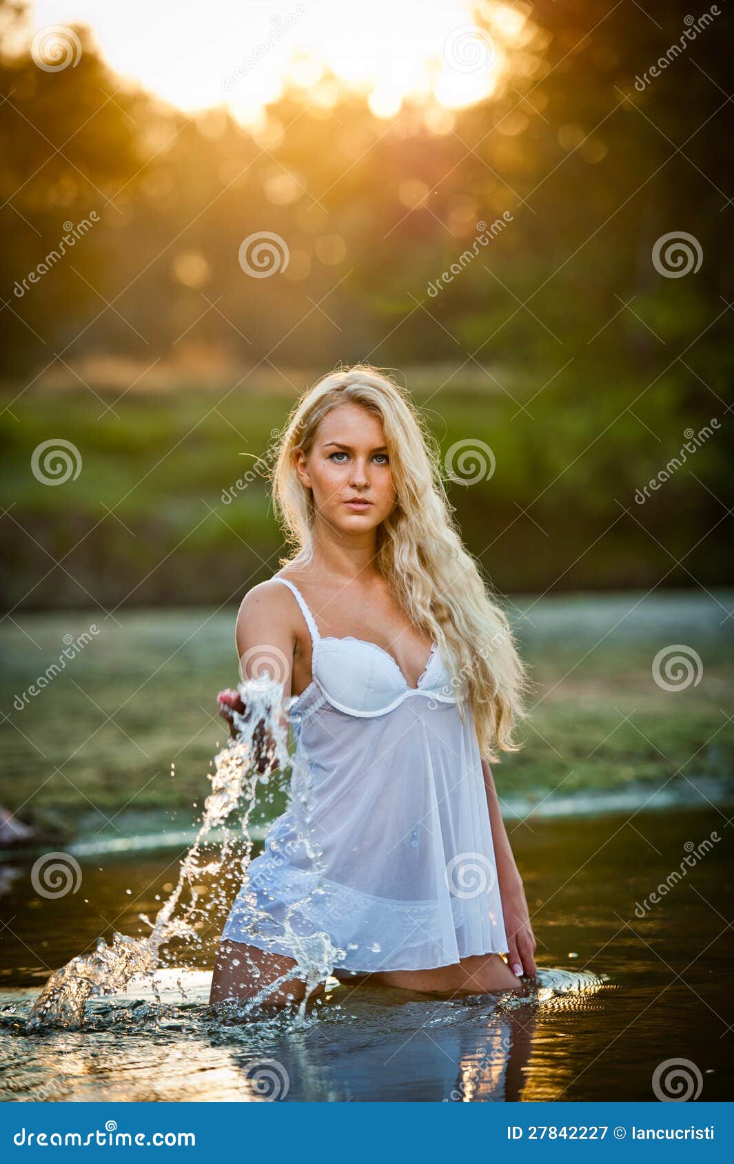 blonde woman in lingerie a river